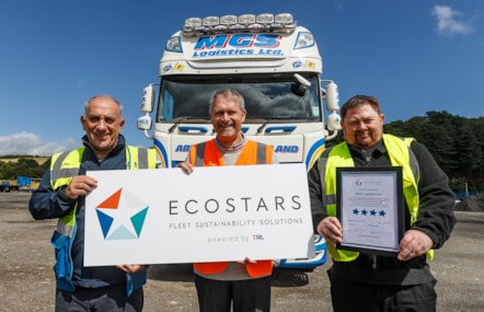 Three representatives of the Fife Ecostars program stand in front of an haulage vehicle to mark the milestone. From right to left, they are Stuart Paley, HSE Manager, MGS Logistics Limited; Stuart McLean, ECO Stars Advisor TRL Limited; Kenny Bisset, Lead Officer, Fife Council's Protective Services - New milestone for Fife ECO Stars scheme