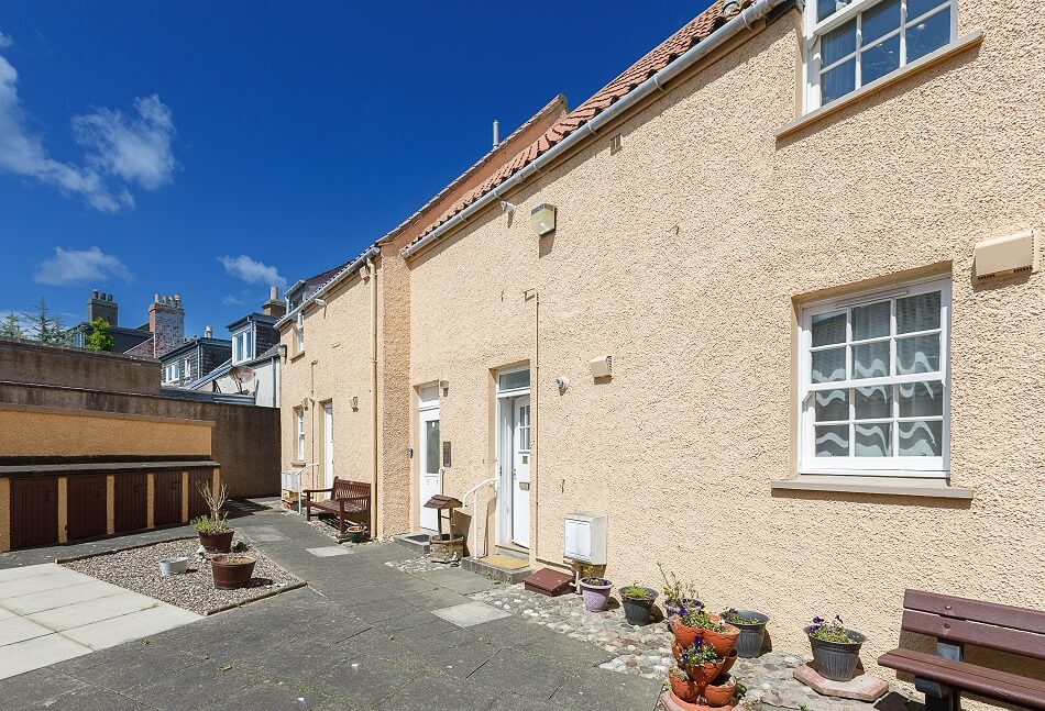 Exterior of the bungalows at Kirkhill with seating area
