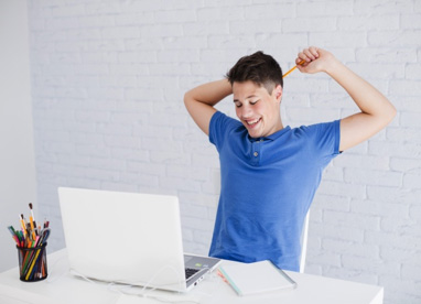 Boy using a laptop computer