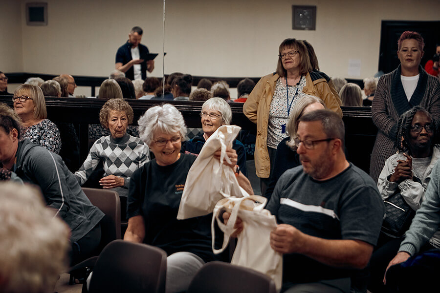 Volunteers delight at receiving the gift bags
