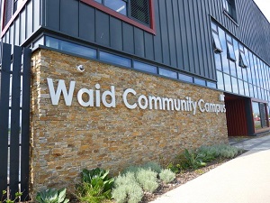 photo of the exterior entrance to Waid High School