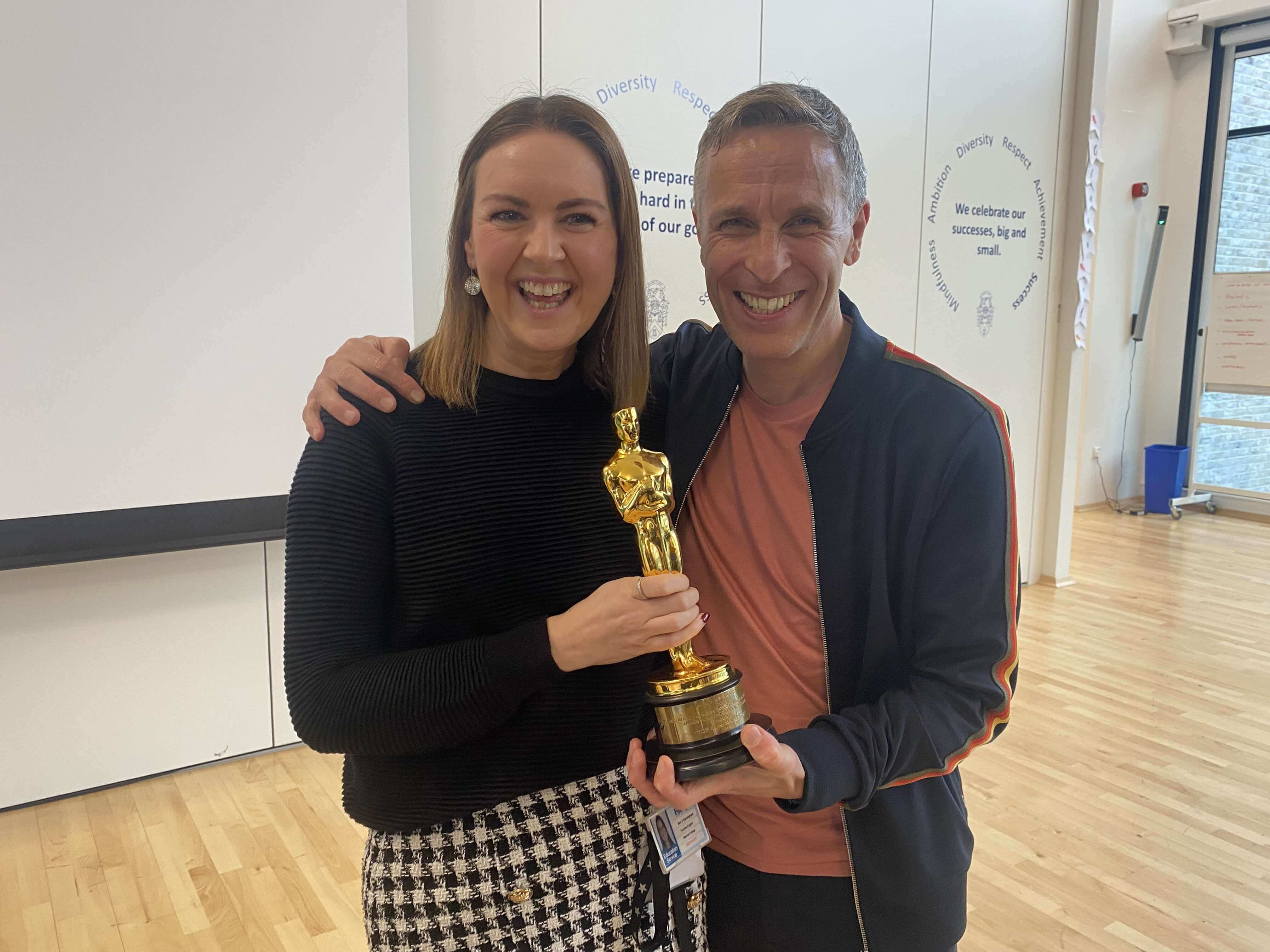 Oscar-winning sound engineer Chris Burdon with Madras college teacher, both smiling and holding an Oscar