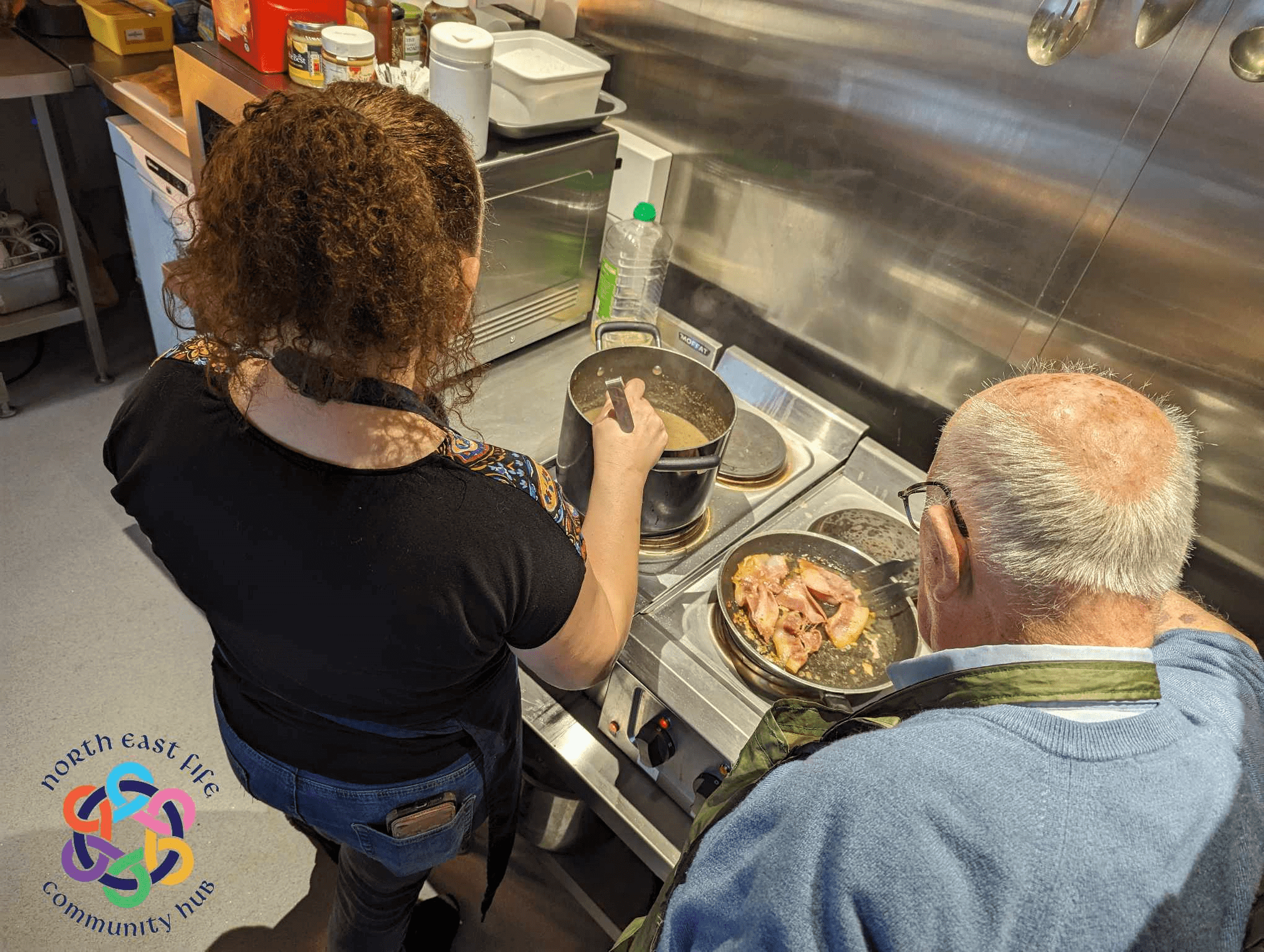Volunteer chefs cooking in kitchen