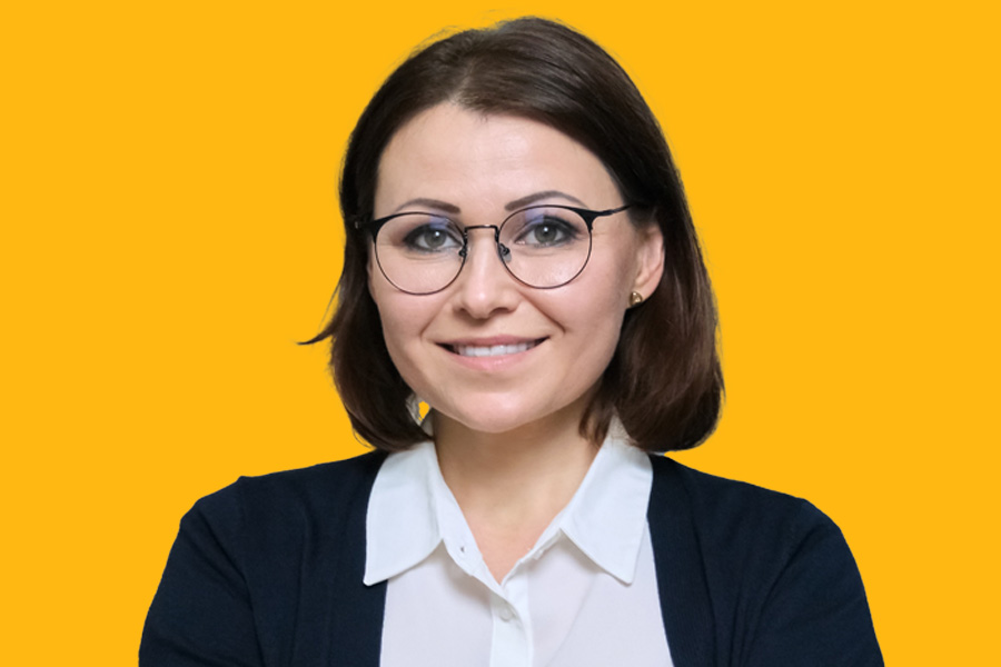 Woman with glasses smiling