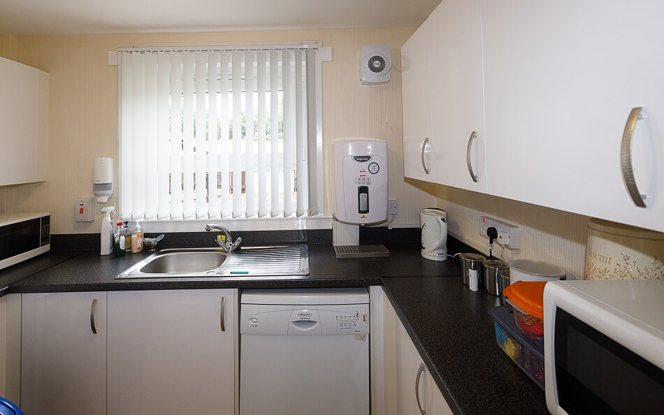 Communal kitchen at Walter Hay Court, with cooking and washing facilities
