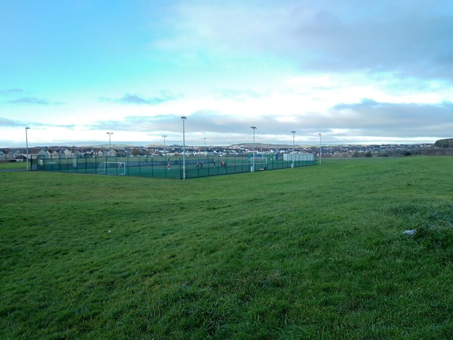 Photo showing the astro pitch in Duloch park and grass area around it