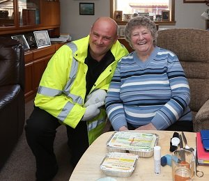 Simon Wilson, Meals on Wheels delivery driver, with Agnes Christie from Leven with her Meals on Wheels. Simon Wilson, Meals on Wheels delivery driver, with Agnes Christie from Leven with her Meals on Wheels.