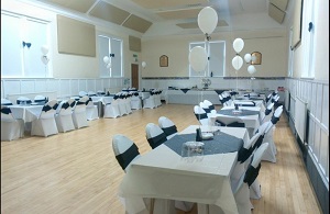 showing the main hall interior all set up for a wedding