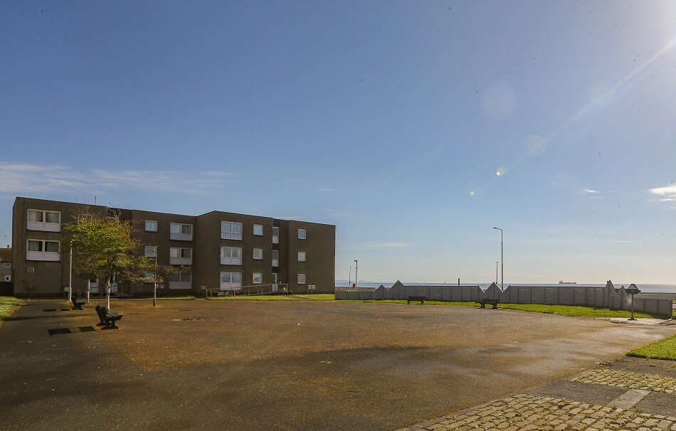 Buchanan Court, with large paved area to the front with benches