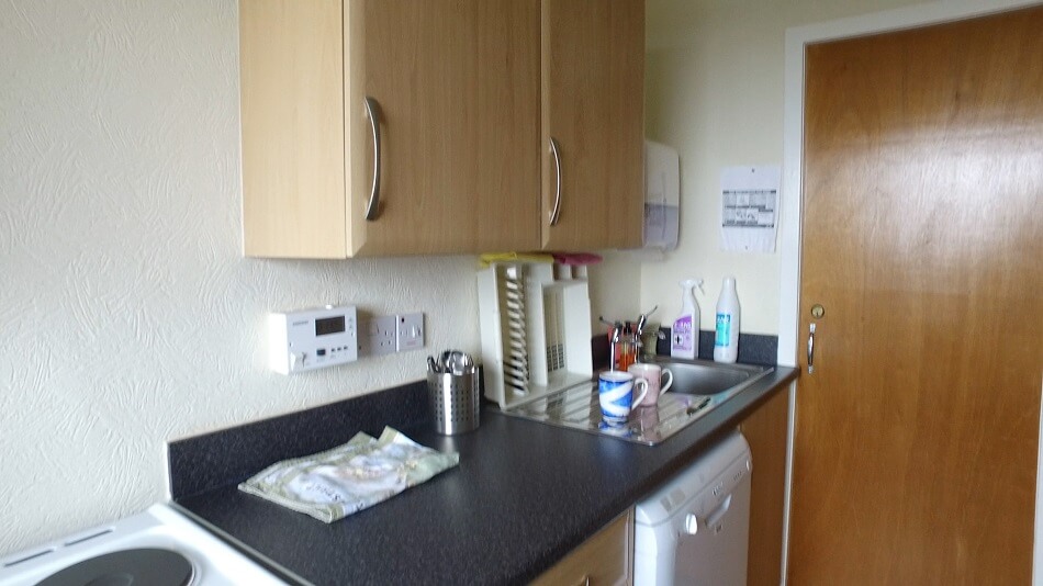 Communal kitchen in Buchanan Court, showing sink area