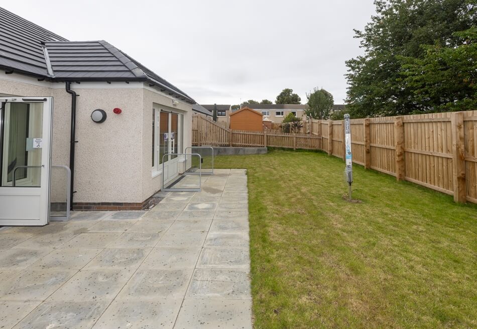 External space outside Lathalmond Square with drying green and patio area