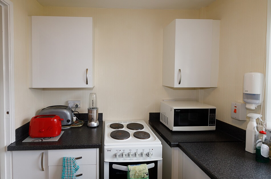 Communal kitchen at Walter Hay Court, with cooker and microwave