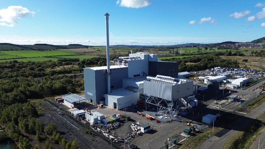 Birds eye view of the Westfield EfW facility, comprising large grey silver buildings with a sunny background.