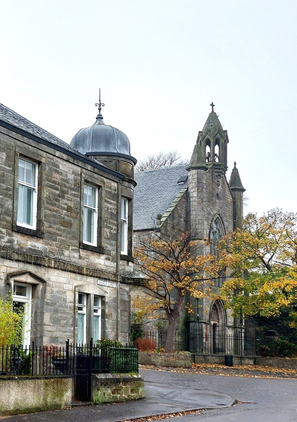 Image shows the corner of the C-listed Royal Bank Building and Parish Church in Buckhaven