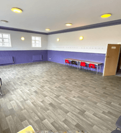 Small hall. The bottom half of the walls are purple.