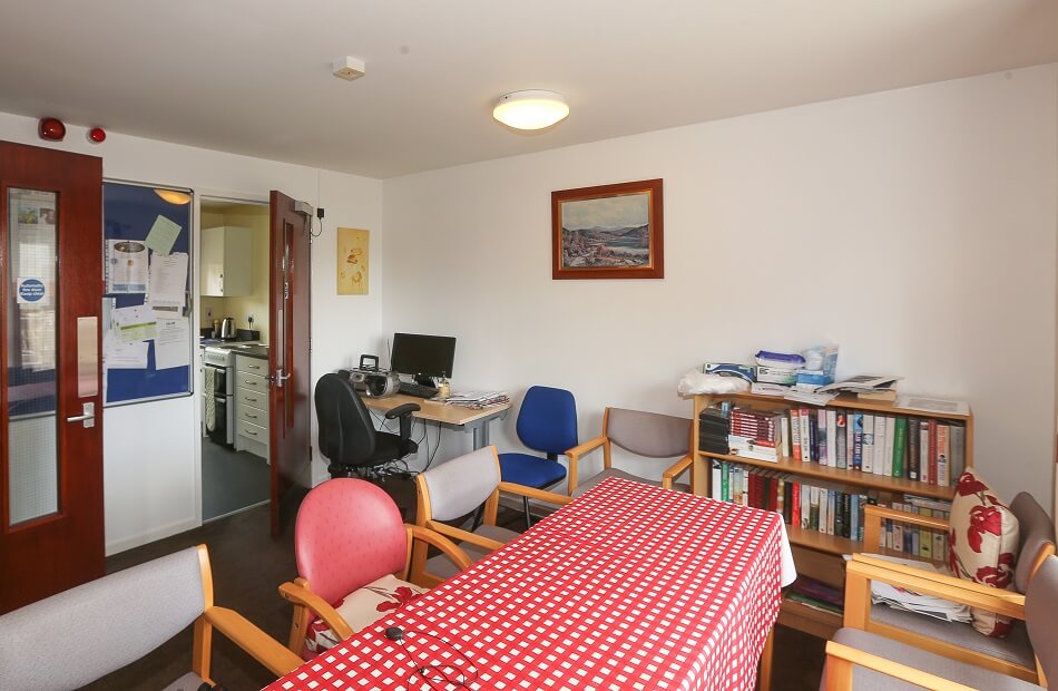 Image of communal seating area and shared computer at Tarvit Green