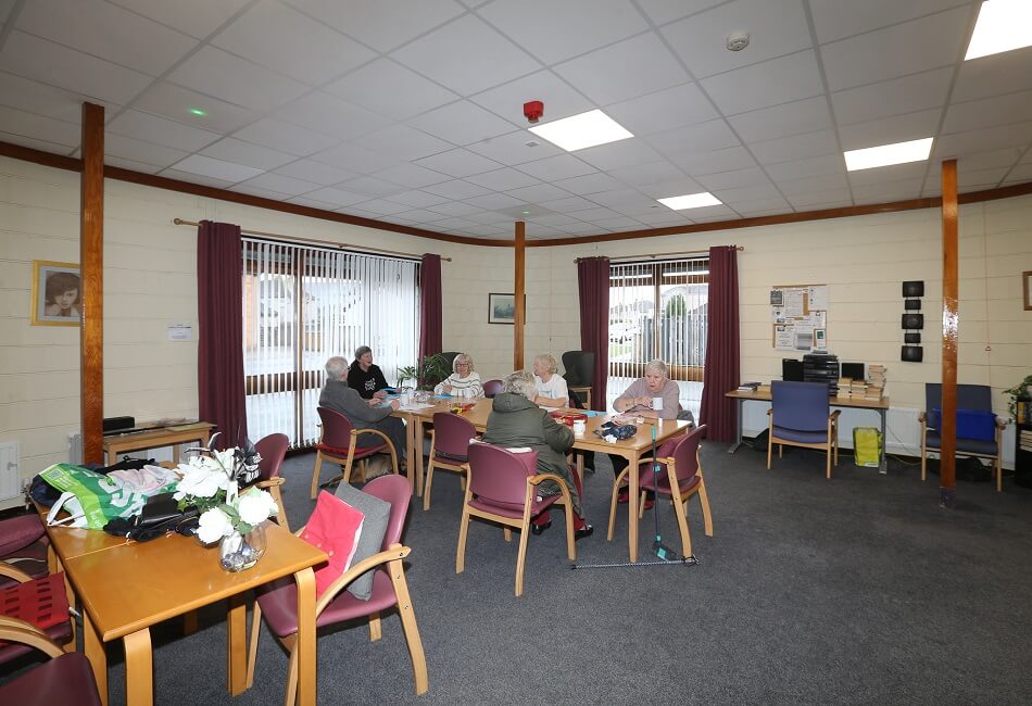Communal seating area, showing residents at Park Road sitting and chatting.