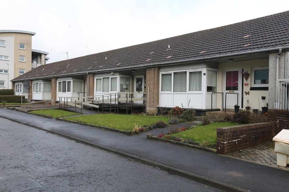 Exterior of the bungalows at Turriff Place, with gardens to the front of the properties