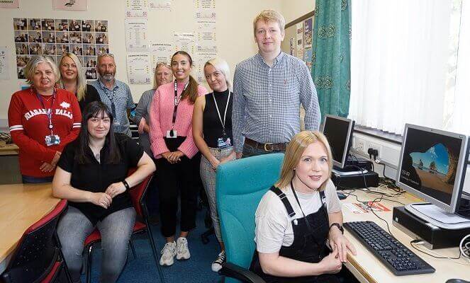 Cllr David Barratt (right, back) visiting support staff in a Community Assistance Hub in Rosyth