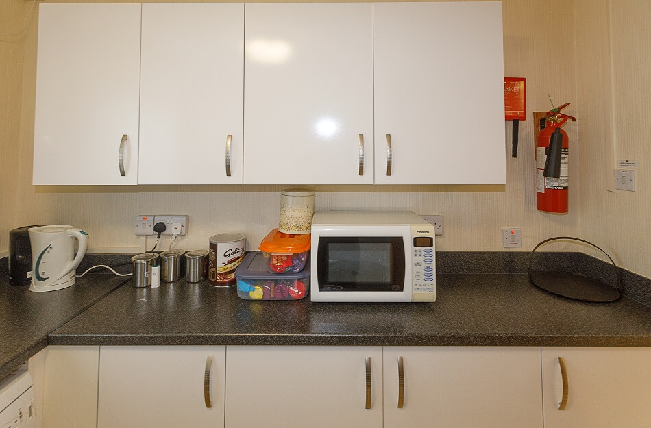 Communal kitchen at Walter Hay Court, with microwave and meal prep area