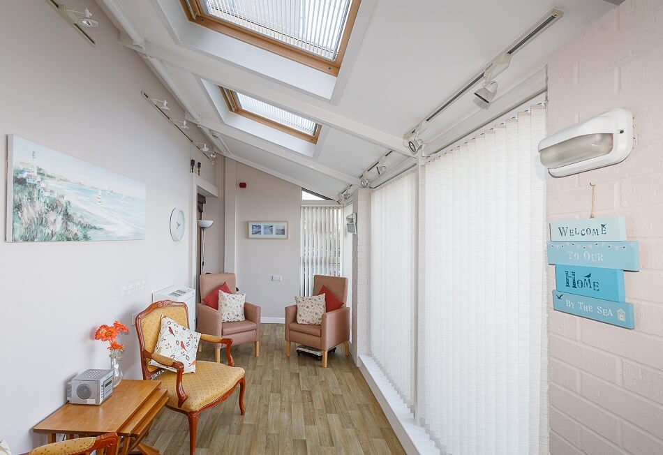 Small seating area with large windows and lots of natural light at Granary Lane