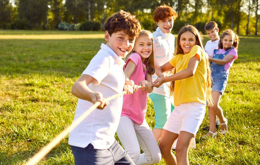 Kids outside playing tug of war - Free summer activities on offer for young people in Dunfermline
