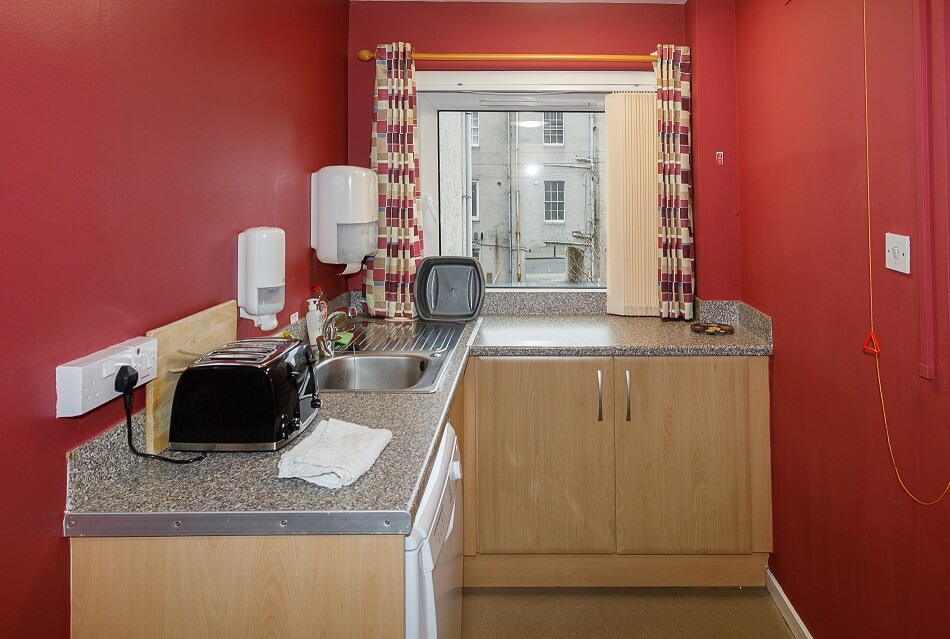 Communal kitchen at Allan Court, with sink and food prep area