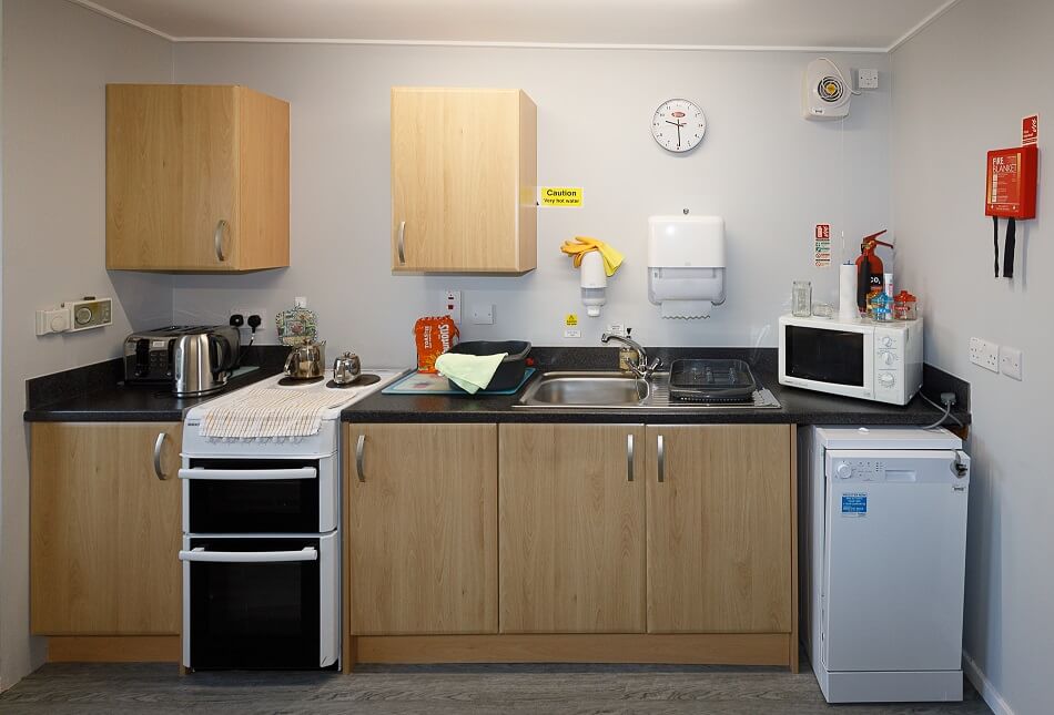 Communal kitchen at Melville Court, with cooking and washing facilities