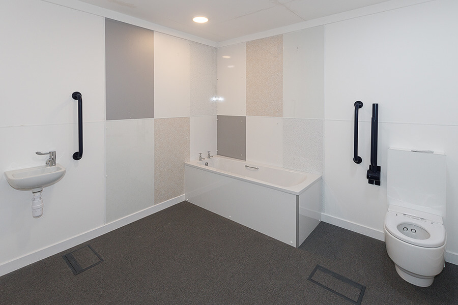 Room pod containing a set-up of a bathroom suite