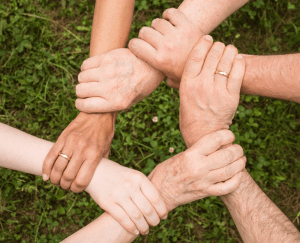 Cost of living linked hands image