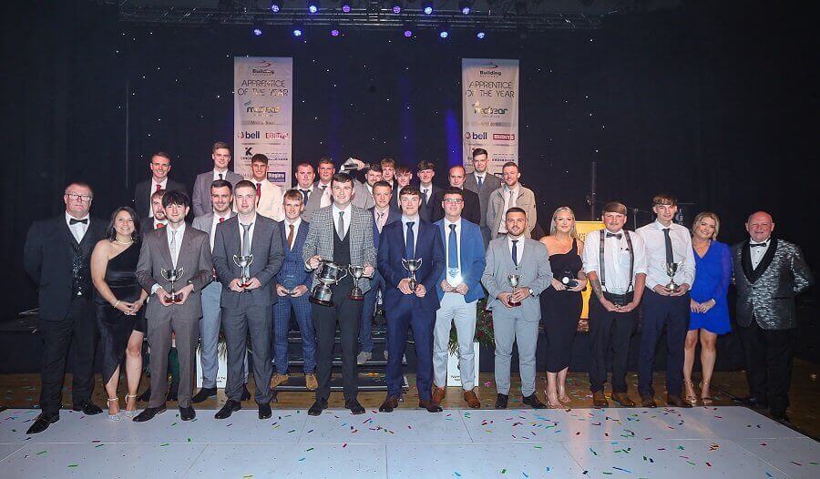 Group photo of apprentices holding their awards
