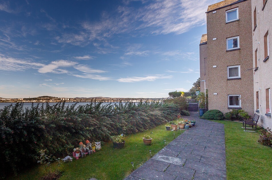 Rear gardens at Granary Lane, with views looking out to the water