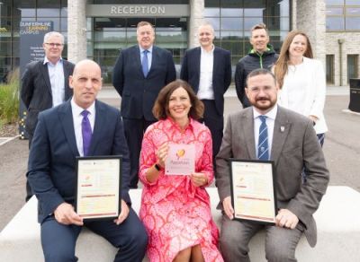 Councillor, headteachers and project team receiving Passivhaus accreditation