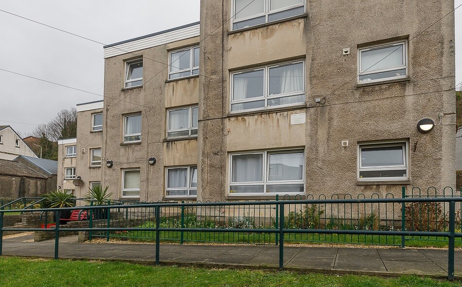Exterior of Allan Court, with footpath and railings