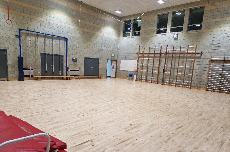 Gymnasium.jpg Picture of gymnasium with wooden floor and climbing wall