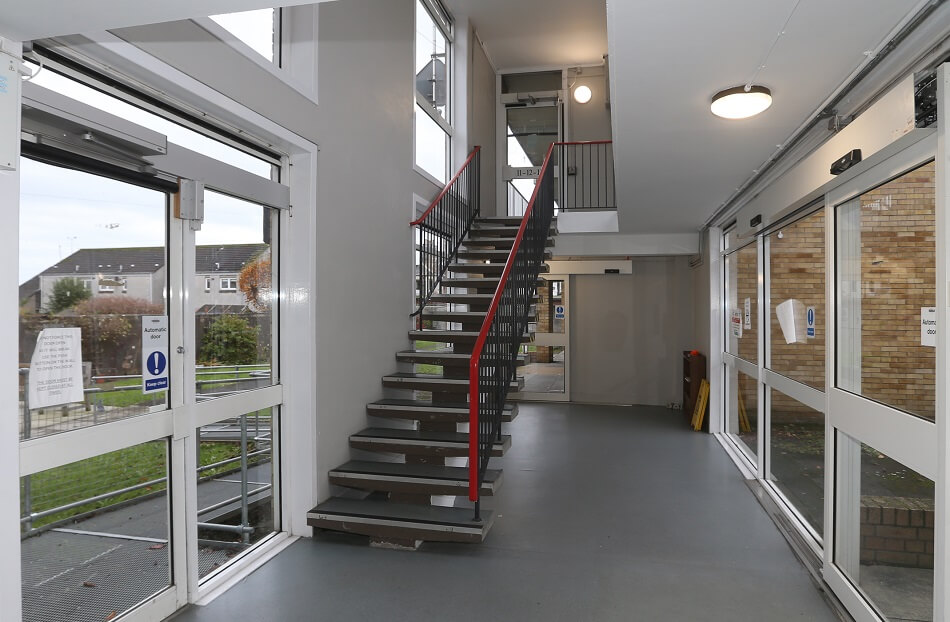 Interior staircase leading to properties at Patterson Place