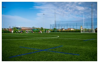 An outdoor floodlit astro pitch