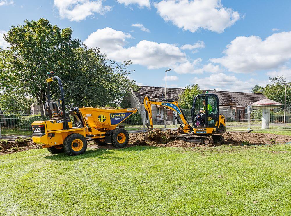 Machinery digging up play park