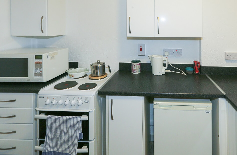 Communal cooker and food prep space in the communal kitchen at Patterson Place