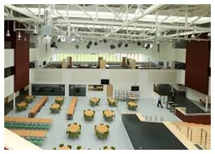 A large room with tables and chairs