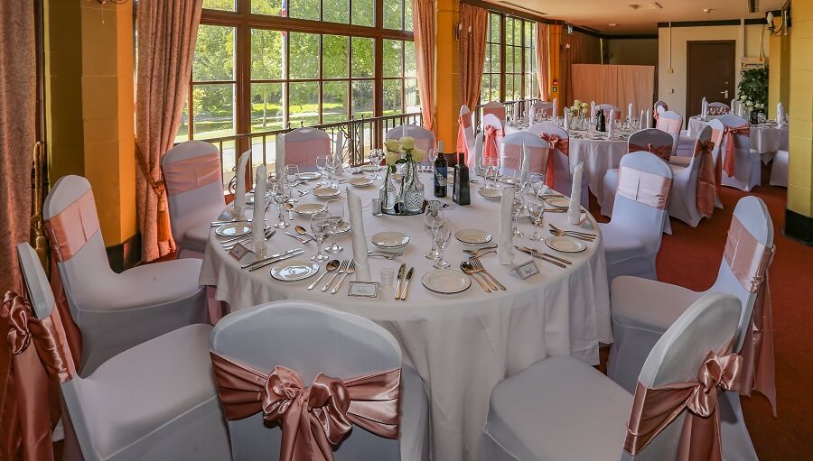 tables and chairs laid out inside pavillion