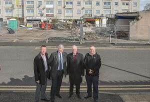 Standing in front of the fenced off flats to be demolished - Norman Laird, Community Manager for Glenrothes; Cllr Altany Craik, Spokesperson for Finance, Economy and Strategic Planning , Cllr. Ross Vettraino, Depute Convener – Glenrothes Area Committee and Cllr. Craig Walker, Convener – Glenrothes Area Committee.