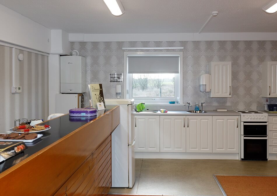 Communal kitchen at Moir Court with meal prep area and cooking facilities
