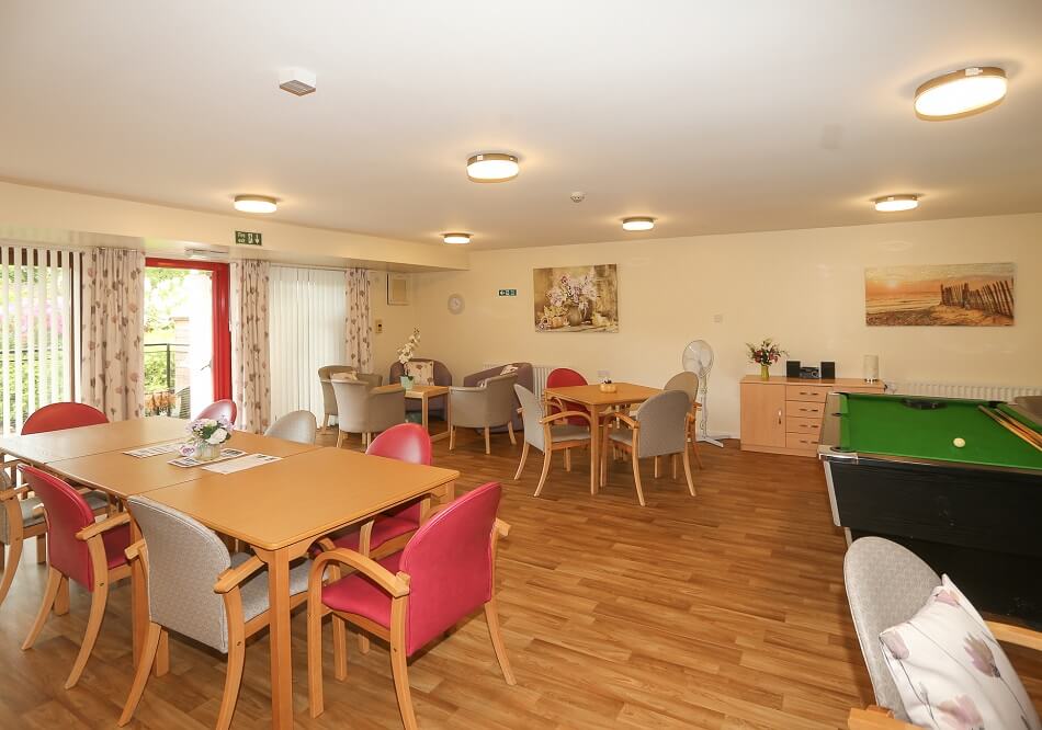 Image of communal seating area and games room at Strathyre Place