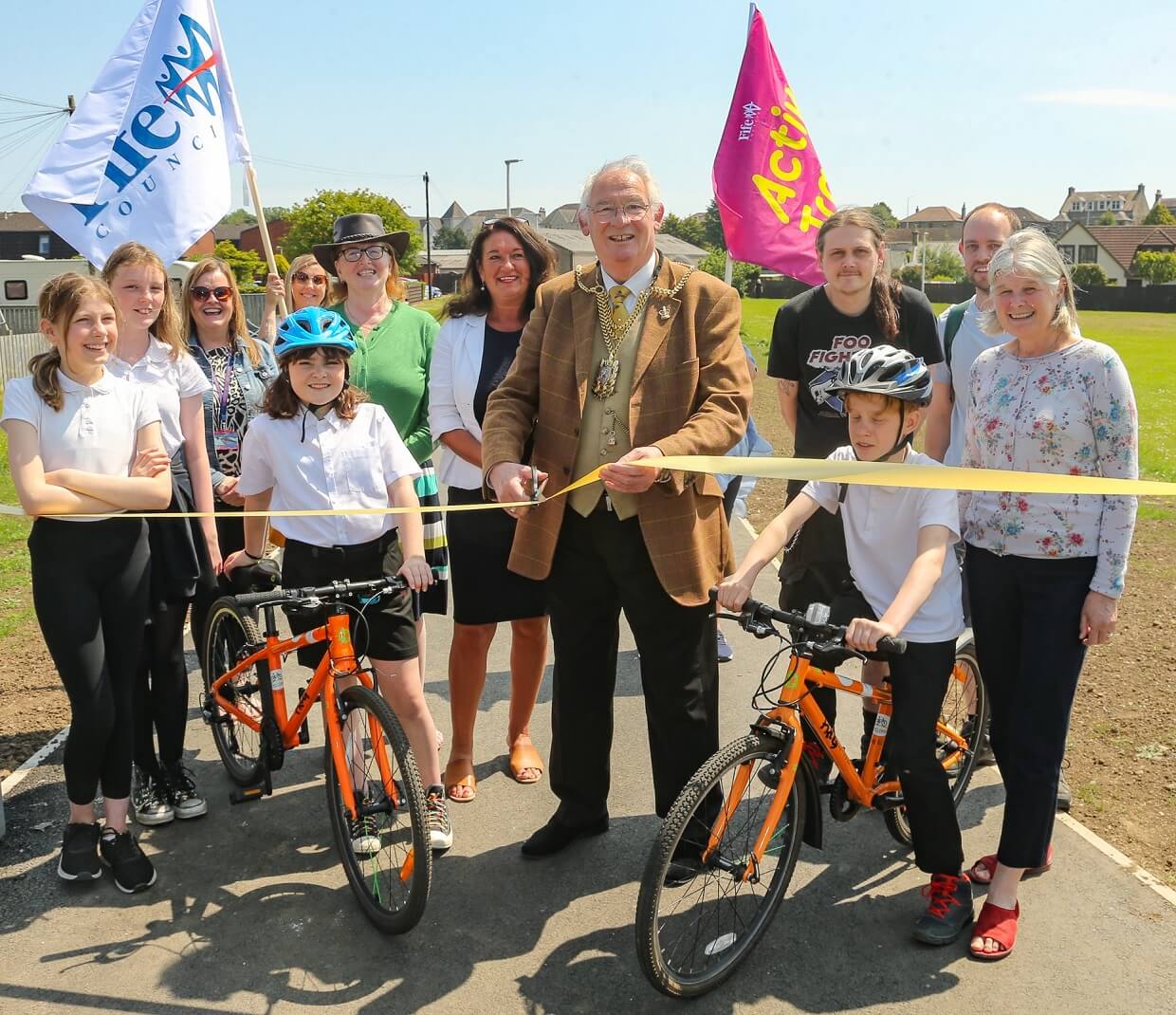 Provost Jim Leishman cutting ribbon at opening ceremony
