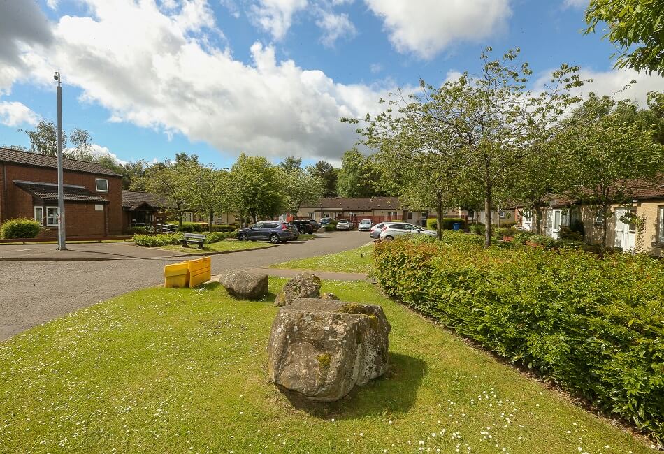 Image of the front of Strathyre Place, with trees and greenery