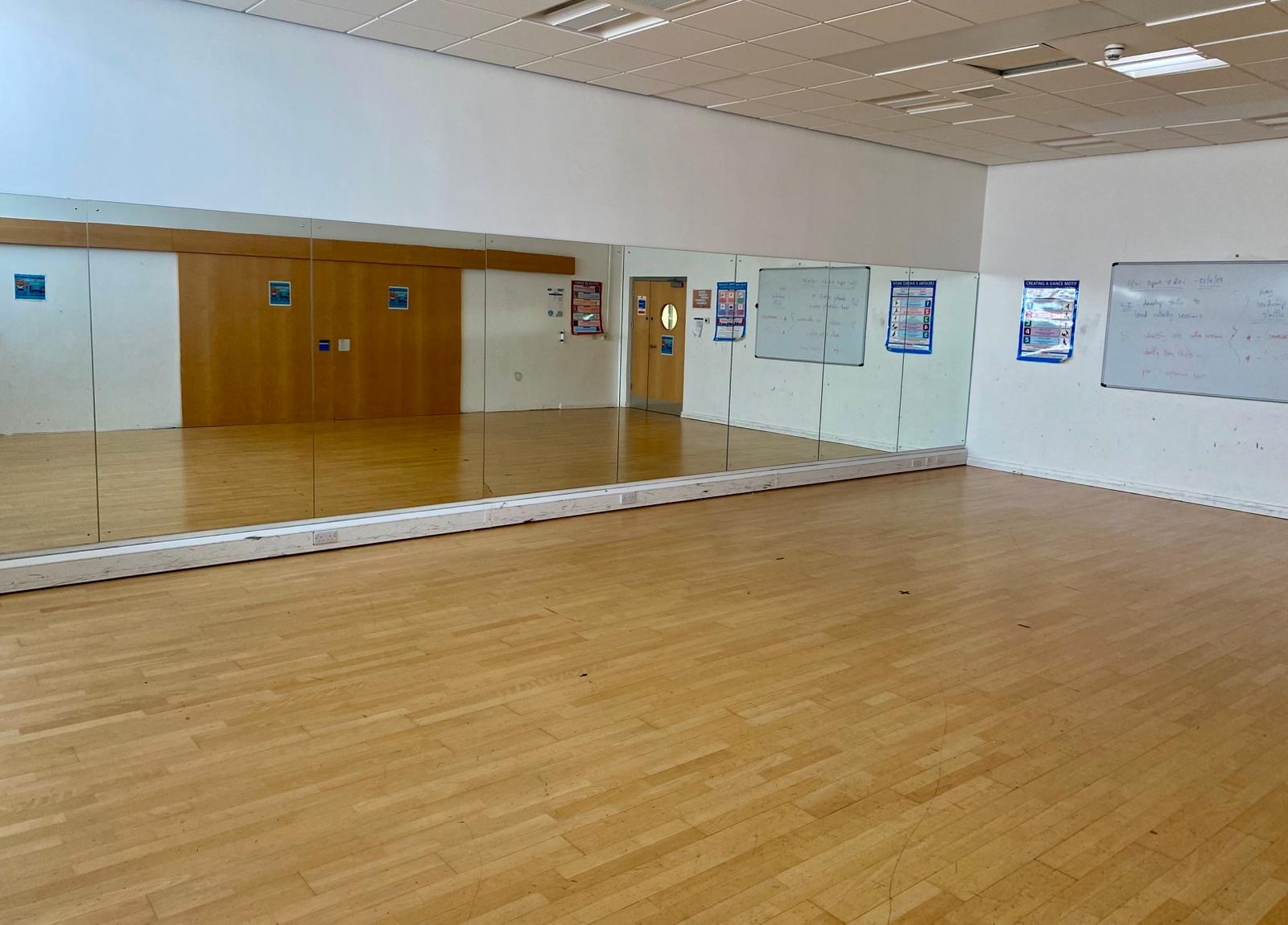 A dance studio showing mirrored wall.