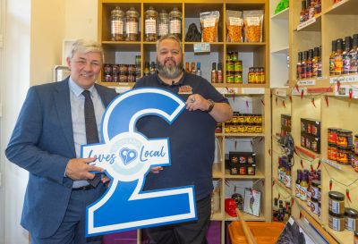 Ewan MacKenzie, owner of Something Different in Cowdenbeath in his shop with Councillor Altany Craik, Fife Council.