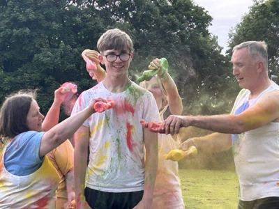Group of people taking part in a colour run