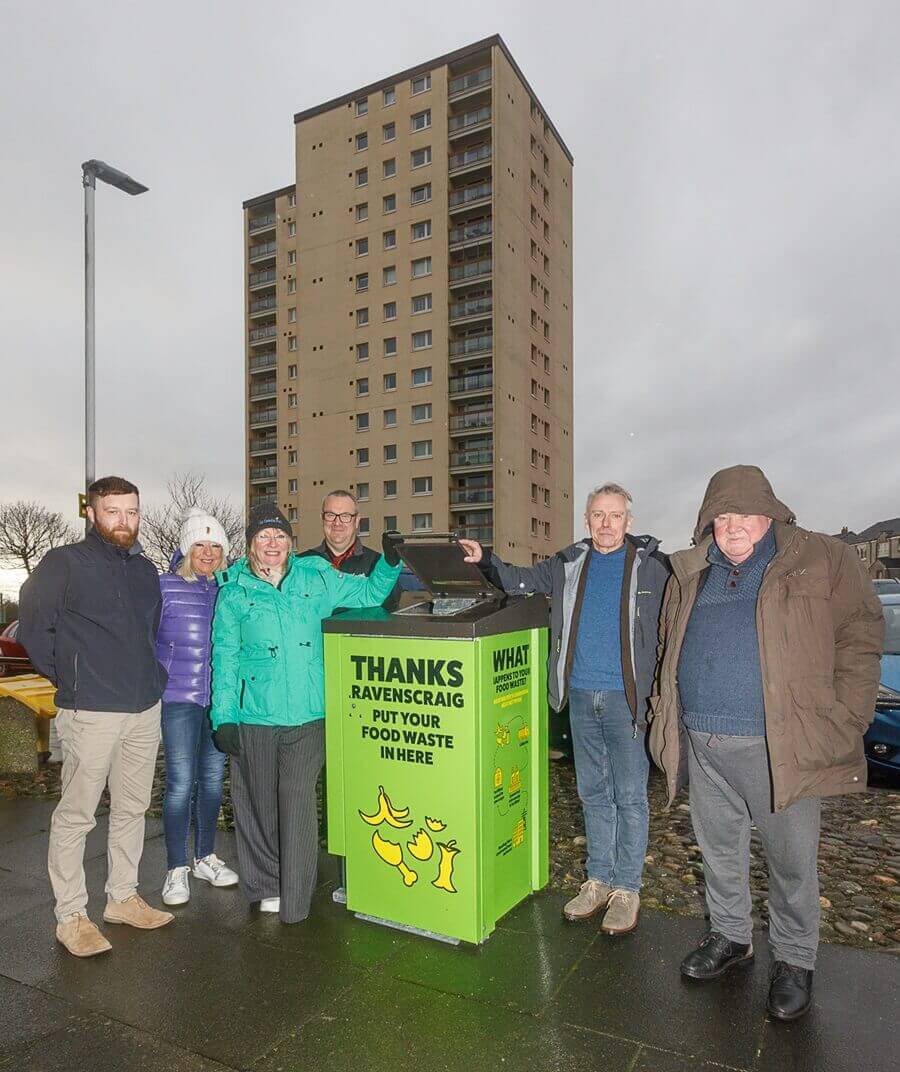 Group photo in front of Ravenscraig flats with the new communal food waste bin